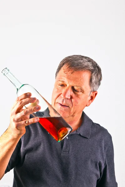 Man drinking alcohol out of the bottle — Stock Photo, Image