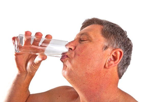 Portrait of attractive man drinking water