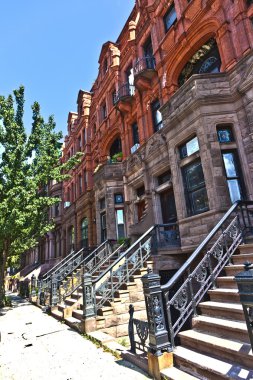 Harlem district and its typical house - New York. clipart