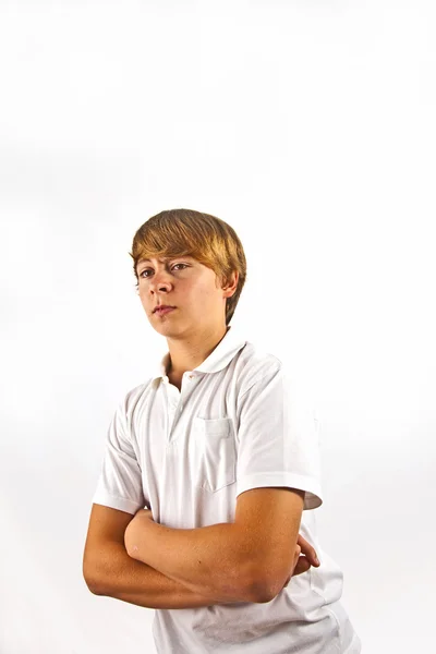 Portret van een leuke jongen met wit shirt in de studio — Stockfoto
