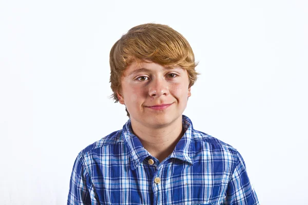 Smiling smart boy in studio Stock Picture