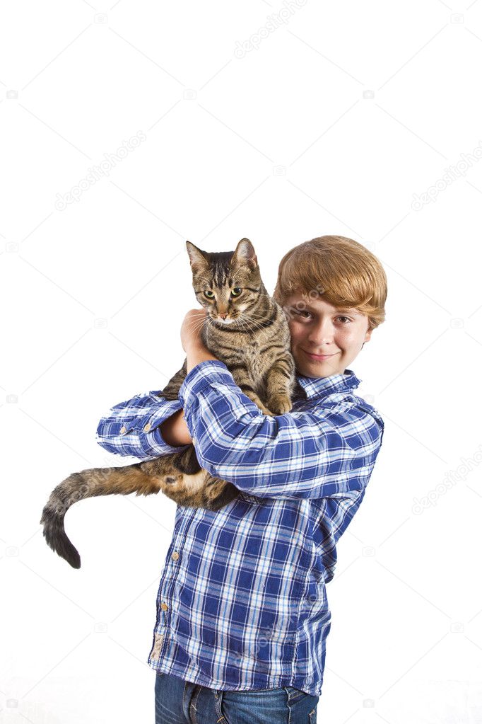 The boy holds on hands of a gray cat
