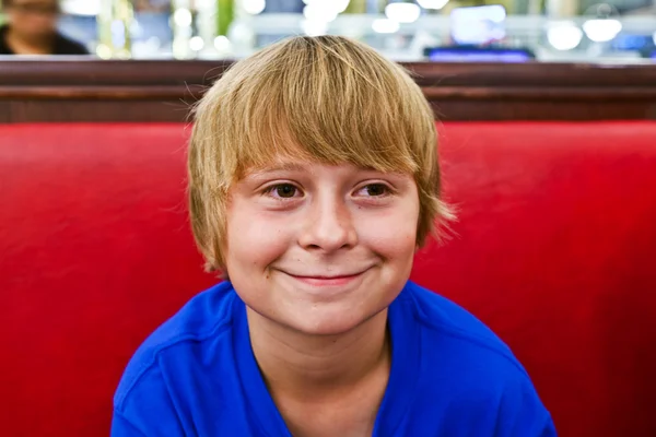 Smart boy in a diners at night — Stock Photo, Image