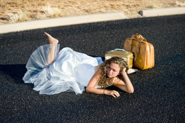 Bride laying in street clipart