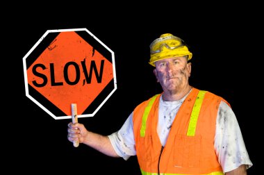 Dirty construction worker holding slow sign clipart