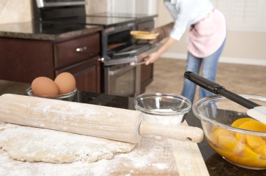 Woman baking a pie clipart