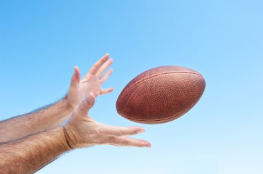 Catching a football clipart