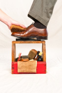 Antique shoe shine box and worker clipart
