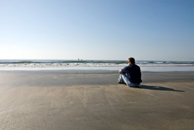 Man alone on beach clipart