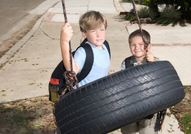 Kids and tire swing clipart