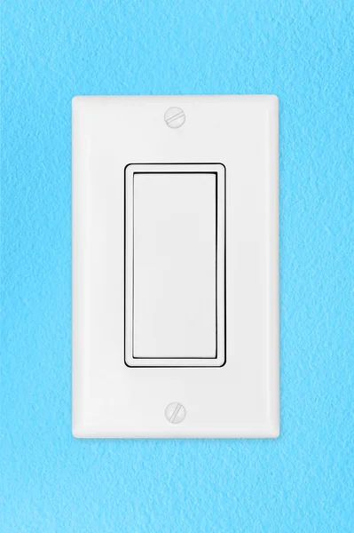 Світловий вмикач на синій стіні — стокове фото