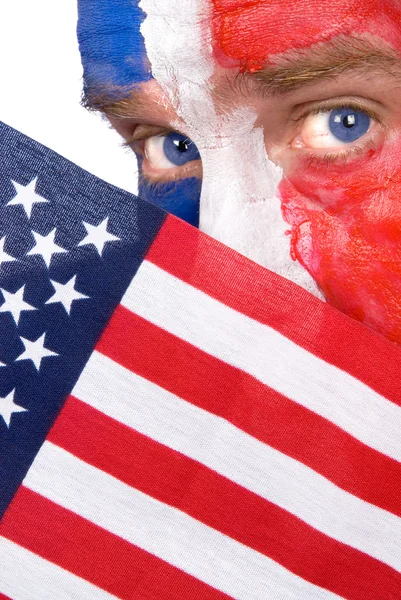 Πατριωτικό άνθρωπος, ανταλλαγής κίνησης πάνω από μια αμερικανική σημαία — Φωτογραφία Αρχείου