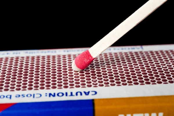 Matchstick on striking surface — Stock Photo, Image