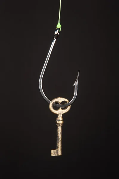 Skeleton key snagged on fishook — Stock Photo, Image