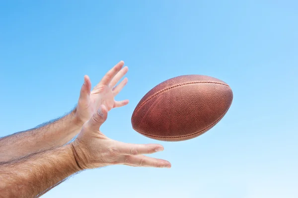 Catching a football — Stock Photo, Image