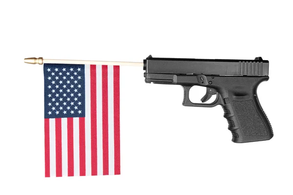 Pistola disparando una bandera — Foto de Stock
