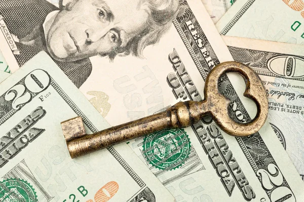 Skeleton key on cash. — Stock Photo, Image