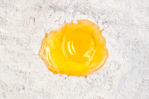 Egg yolk in flour — Stock Photo, Image