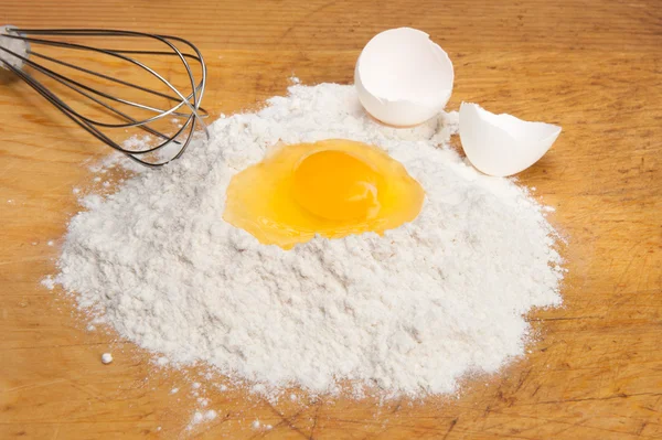 Egg yolk in flour — Stock Photo, Image