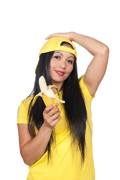 Азиатка ест банан — стоковое фото