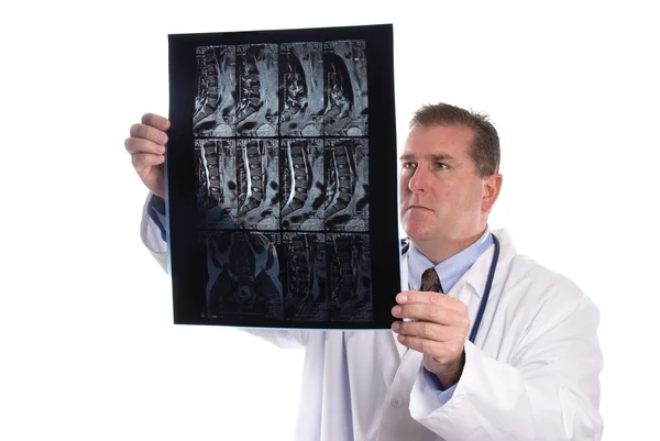 Doctor reviews X-rays — Stock Photo, Image
