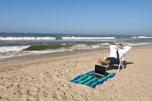 Businessman on beach — Stock Photo, Image