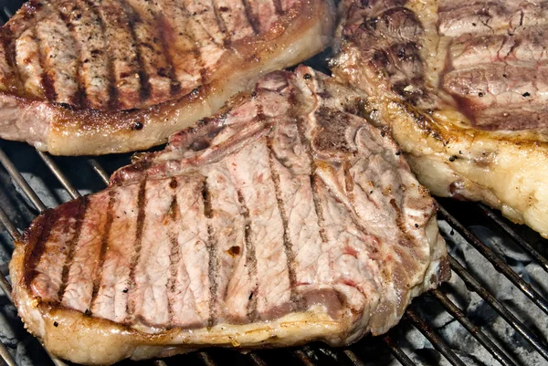 Barbecued steaks — Stock Photo, Image
