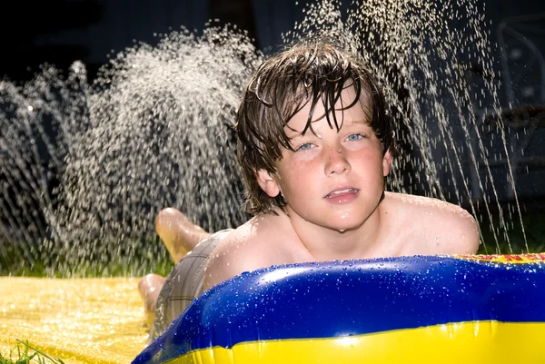 Water slide and boy — Stock Photo, Image