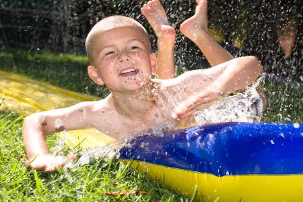Water slide and kid — Stock Photo, Image