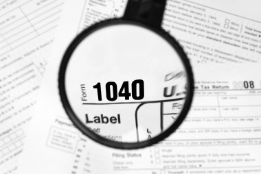 Magnified income tax form clipart