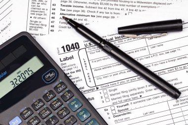 Tax forms, calculator and pen clipart