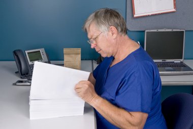 Doctor reviewing document clipart