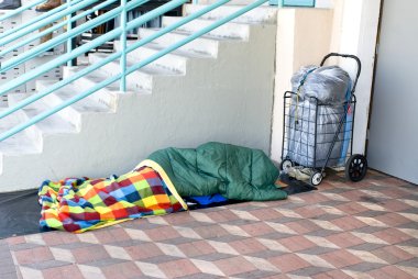 Homeless person sleeping clipart