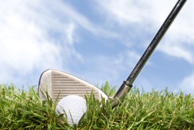 Golf club and ball in the rough clipart