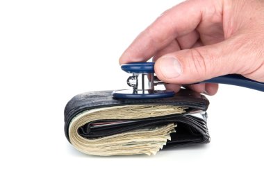 Wallet with cash eing examined with stethoscope. clipart