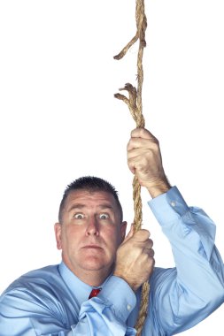 Businessman hanging from fraying rope clipart