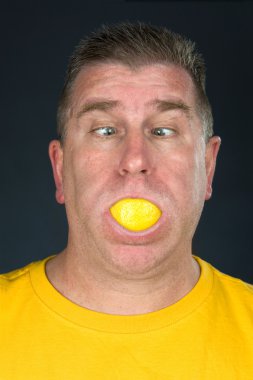 Man sucking on lemon clipart