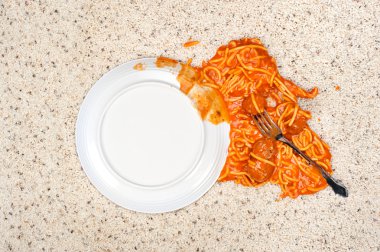 Dropped plate of spaghetti on carpet clipart