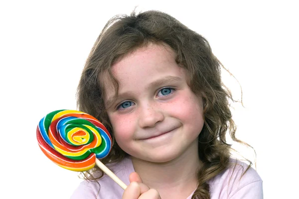 Liten flicka och godis pin hjulet sucker — Stockfoto