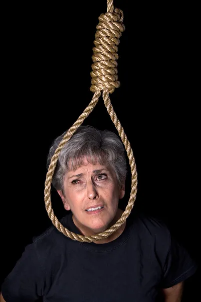Elderly woman comitting suicide — Stock Photo, Image