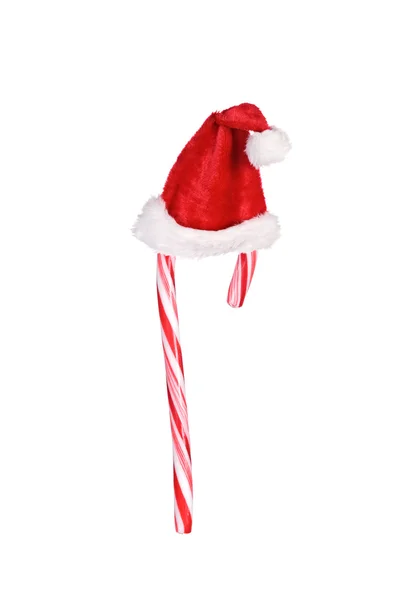 Candy cane and santa hat — Stock Photo, Image