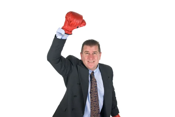 Бизнесмен, поднимающий руку к победе — стоковое фото