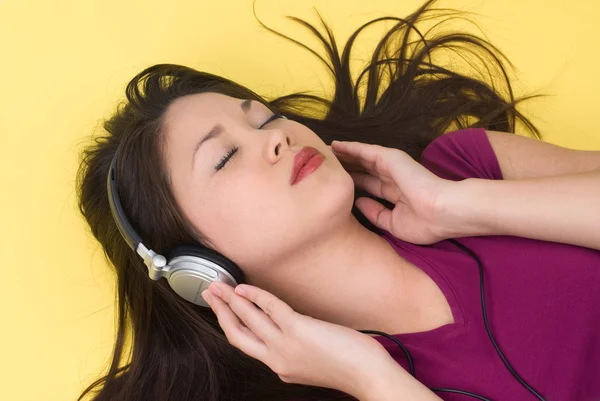 stock image Woman listening to music