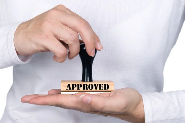 Woman holding approval rubber stamp — Stock Photo, Image