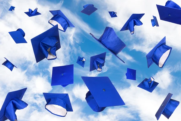 Graduation caps in flight — Stock Photo, Image