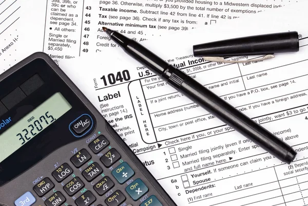 Tax forms, calculator and pen — Stock Photo, Image