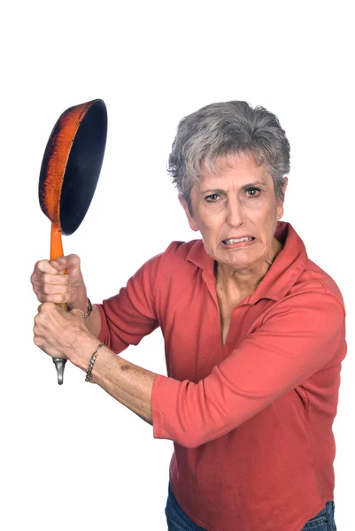 Angry mother swinging a frying pan — Stock Photo, Image