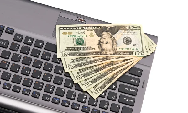 Cash on laptop keyboard. — Stock Photo, Image