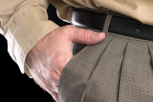 Man met hand in pak zak — Stockfoto
