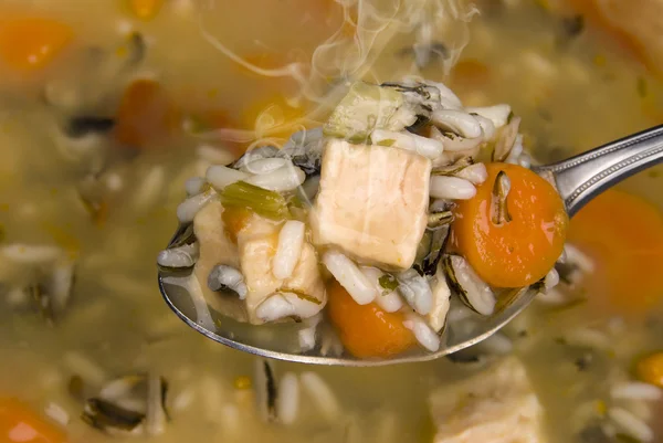 stock image Spoon full of chicken and rice soup